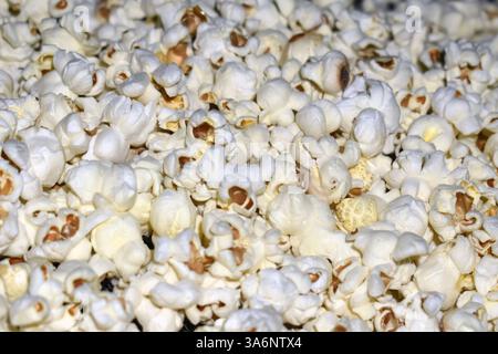 Popcorn in a plastic bag as a background. Close-up Stock Photo