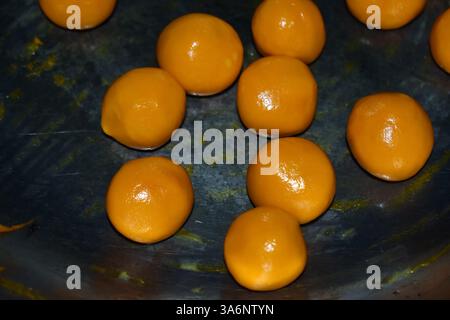 indian sweet gulab jamun oil frying in pan for celebration of festival. Stock Photo