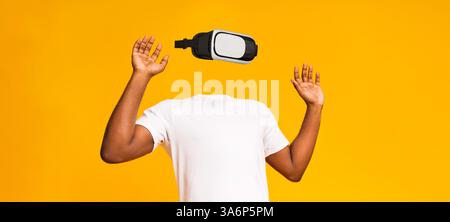 User interacts with virtual reality technology in a vibrant setting Stock Photo