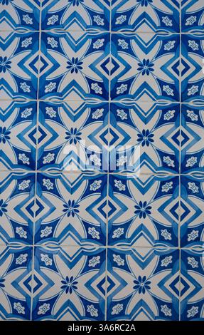 Close up example of a Portuguese blue tile, called azulejo, from the side of a building in the city of Porto in Portugal. Stock Photo