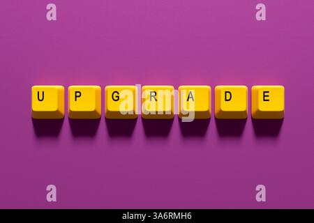 Upgrade concept. Computer keyboard keys spelling the word upgrade on a purple background. 3D render Stock Photo
