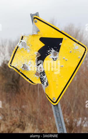 Road sign with shotgun holes,Quebec,Canada Stock Photo
