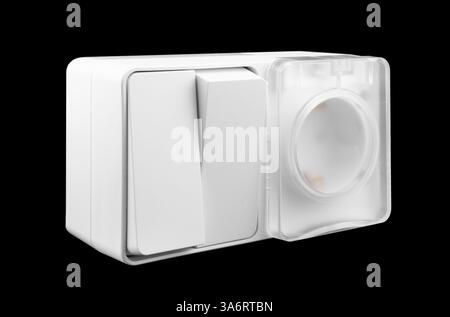 Electric light switch and socket isolated on white background. Electrical power socket and plug switched. Stock Photo