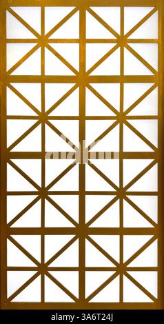 Close up of gold steel metallic laser cut pattern in geometric star shape, with white background. Golden paint screens panel and 3D laser cutting shap Stock Photo