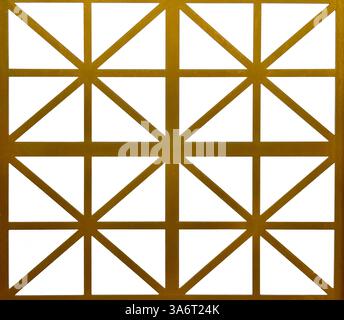 Close up of gold steel metallic laser cut pattern in geometric star shape, with white background. Golden paint screens panel and 3D laser cutting shap Stock Photo
