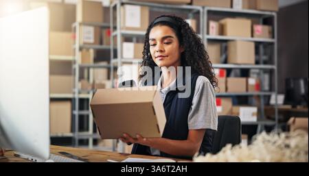 Woman, scanner and box for warehouse distribution of inventory management, order barcode and stock. Person, computer and package for reading price Stock Photo