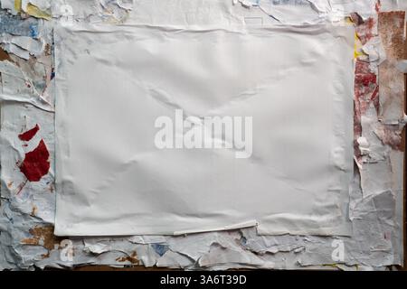 Wheatpaste poster style texture on a dirty wall Stock Photo