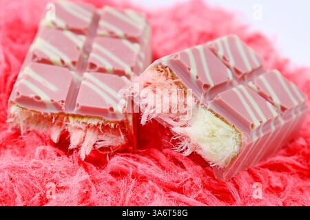 Trendy pink Angel Hair Chocolate bar with Turkish pishmaniye cotton candy filling close up Stock Photo