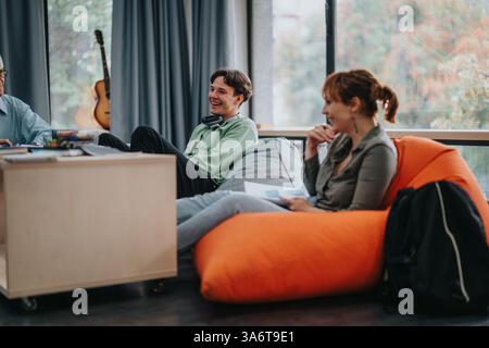 Professor engaging with students in a casual learning environment Stock Photo