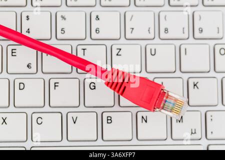Network cable to keyboard Stock Photo
