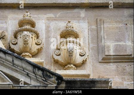 Decorative stone vases on the facade of the Seville Cathedral. Stock Photo