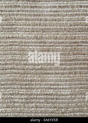 Close up of golden beige fabric in horizontal fluted or stripes pattern. Seamless background texture. Stock Photo