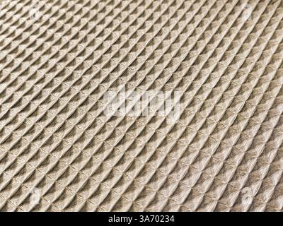 Close up fabric in geometrical checkered and triangular pyramid pattern, in light brown and beige white color. Beveled checkered shapes fabric, seamle Stock Photo