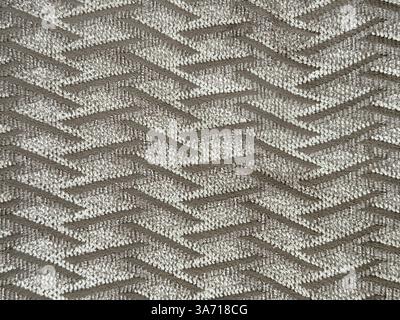 Close up of brown grey fabric in weaving thread pattern. Brown fabric textile with chevron weaving, Seamless background texture. Stock Photo