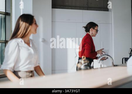Multicultural business workers enjoying a break in modern office Stock Photo