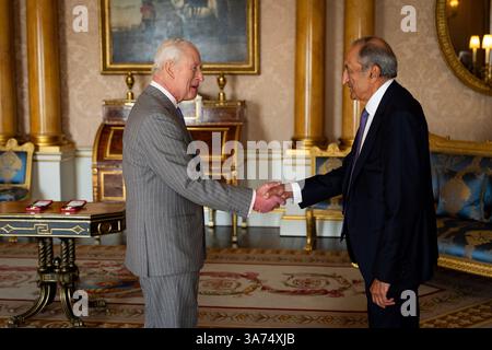King Charles III, Patron, the Royal Society, receives Sir Ravinder Maini during an audience where he presented the Royal Geographical Medal, at Buckingham Palace, London. Picture date: Wednesday March 26, 2025. Stock Photo