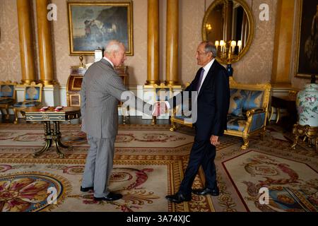King Charles III, Patron, the Royal Society, receives Sir Ravinder Maini during an audience where he presented the Royal Geographical Medal, at Buckingham Palace, London. Picture date: Wednesday March 26, 2025. Stock Photo