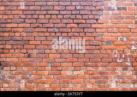 Very old hand made brick wall Stock Photo