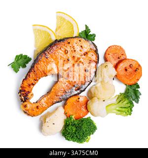 Grilled salmon fish steak with steamed vegetables isolated on white background, top view. Healthy fitness food, keto diet meal, design elements. Stock Photo