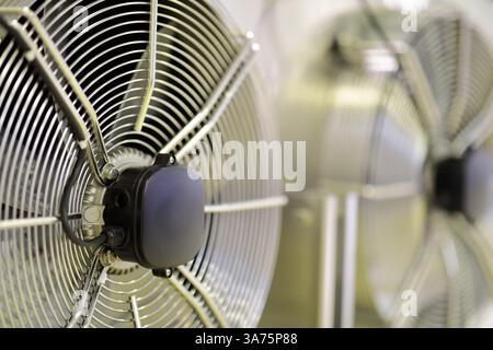 Condenser section with fans of industrial HVAC system. An HVAC system provides heating, ventilation, and air conditioning in buildings. . Selective fo Stock Photo