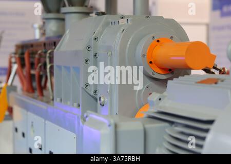 Industrial plastic extruder machine close up. Plastic extrusion machine. Selective focus. Stock Photo