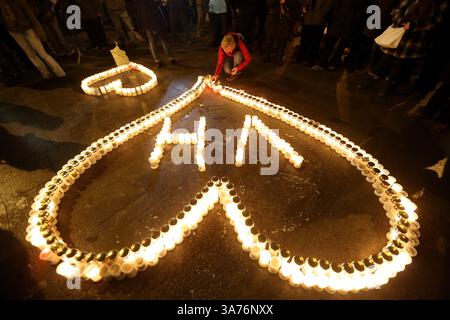 Dec. 18, 2012 - Prague, Czech Republic - A woman lights on the first anniversary of the death of former president Vaclav Havel at St. Wenceslas. Havel, was an anti-Communist playwright who became Czech president and a worldwide symbol of peace and freedom after leading the bloodless ''Velvet Revolution''. He died on December 18, 2011 in Prague aged 75. (Credit Image: © Matej Divizna/ZUMAPRESS.com) Stock Photo