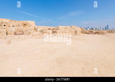Manama skyline behind ancient Bahrain Fort Stock Photo - Alamy