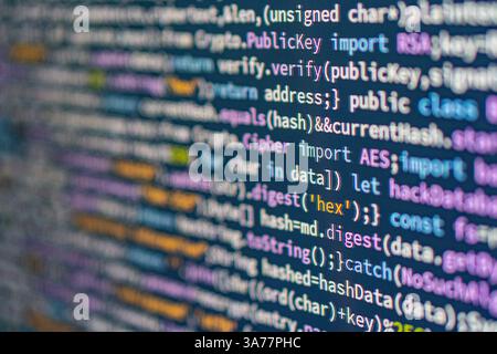 Close-up of coded Python script on a colorful screen blue, purple, yellow, with highlighted text and monospaced font Indicates a structured block, pos Stock Photo