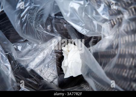 A plastic bag containing a piece of paper is inside it Stock Photo