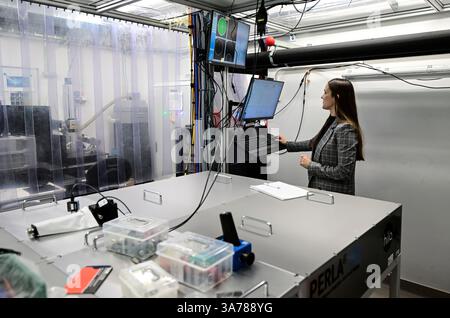 Miroslava Flimelova, research assistant at the Institute of Physics of the CAS, presented the LasApp project at the HiLASE Centre, Dolni Brezany, Central Bohemian Region, Czech Republic, March 26, 2025, which develops laser surface treatment against bacteria at the BIOCEV and HiLASE Centre. Scientists in the Czech Republic are developing new surfaces that prevent microorganisms from adhering. Their surface communities, called biofilms, often contaminate medical equipment or damage industrial facilities. Experts are working on laser technologies that can suitably modify the surface at the micro Stock Photo