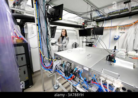 Miroslava Flimelova, research assistant at the Institute of Physics of the CAS, presented the LasApp project at the HiLASE Centre, Dolni Brezany, Central Bohemian Region, Czech Republic, March 26, 2025, which develops laser surface treatment against bacteria at the BIOCEV and HiLASE Centre. Scientists in the Czech Republic are developing new surfaces that prevent microorganisms from adhering. Their surface communities, called biofilms, often contaminate medical equipment or damage industrial facilities. Experts are working on laser technologies that can suitably modify the surface at the micro Stock Photo