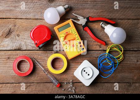 Different electrical tools on wooden table, flat lay Stock Photo