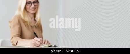 Mature Freelancer Writing Down Plans Project Into Notebook Stock Photo