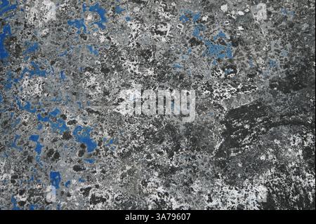 Detail of damaged concrete wall background. Simple grunge with dark edges. Stock Photo