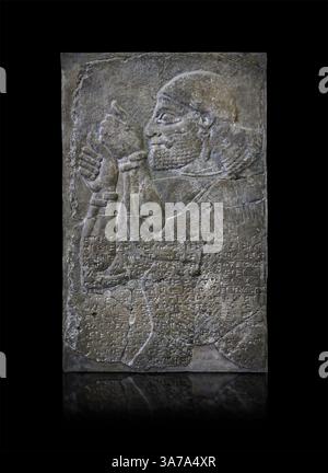 Ancient Neo Assyrian alabaster palace relief sculpture depicting a tribute bearer, from the North West Palace of Ashurnasirpal II,  Nimrud, 883-859 BC Stock Photo