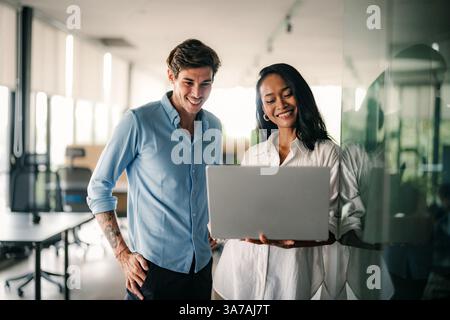 Mixed team of software engineers brainstorming ideas. Diverse app developers collaborating as group Stock Photo