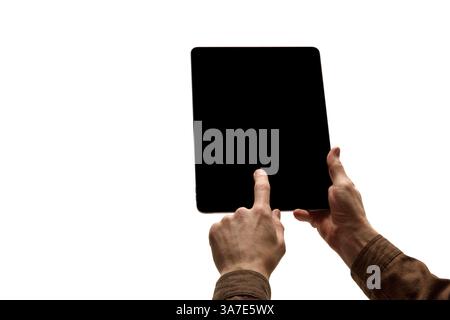 Person interacting with tablet with blank black screen isolated on white background. Stock Photo
