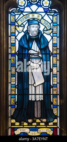 Stained glass depicting Abbot Edward Knowle holding a scroll containing a sketch of the rebuild of the Abbey Church Bristol Cathedral England UK. Marc Stock Photo