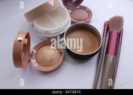 Set of decorative cosmetics and makeup brushes on a white background Stock Photo