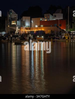 A nighttime picture of the lights of Watchet reflecting across the inner harbour at Watchet Marina, Watchet, Somerset, England, UK. Stock Photo