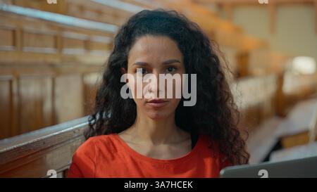 Portrait serious Hispanic student girl Latina woman Caucasian female lady using laptop online studying internet learning computer pc e-learning in Stock Photo
