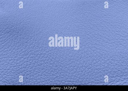Lilac leather with an embossed texture. Stylish material for fashion design. Blue leather texture, soft grain, subtle wrinkles closeup. Leather Stock Photo