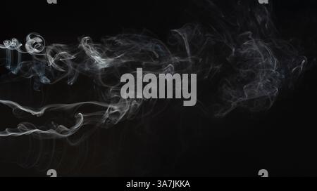 Abstract wavy curly lines smoke on black background Stock Photo