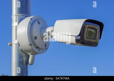 The IP CCTV camera installed on the pole has a waterproof cover to protect the camera. Security system concept. Stock Photo