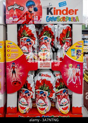 Italy - March 25, 2025: Kinder Ferrero - Miraculous - Grand Surprise Easter chocolate eggs in colored cardboard display for sale in Italian supermarke Stock Photo
