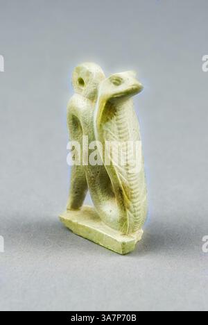 A finely carved green stone sculpture depicting a stylized figure entwined with a snake, showcasing intricate details on both the figure and serpent. The piece emphasizes the fluidity of form and the connection between the two entities., Classic art with a modern twist reimagined by Artotop, Amulet of a Cobra, Third Intermediate Period, Dynasty 21–25 (1070–656 BC), Egyptian, Egypt, Faience Stock Photo