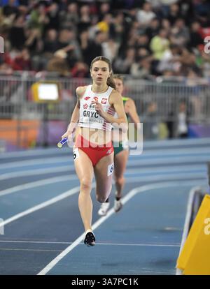 Anna Gryc of Poland competing in the women’s 4x400m relay change over