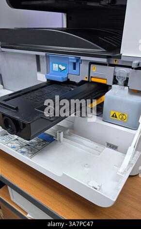 Replacing toner cartridge in modern multifunction printer, troubleshooting and maintenance Stock Photo