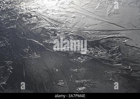 Closeup of patterns and textures formed by freezing on river Stock Photo