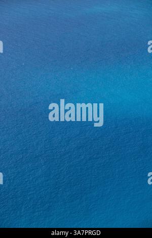 A textured view of deep blue sea water in Greece, showing natural waves and subtle color gradients. Stock Photo